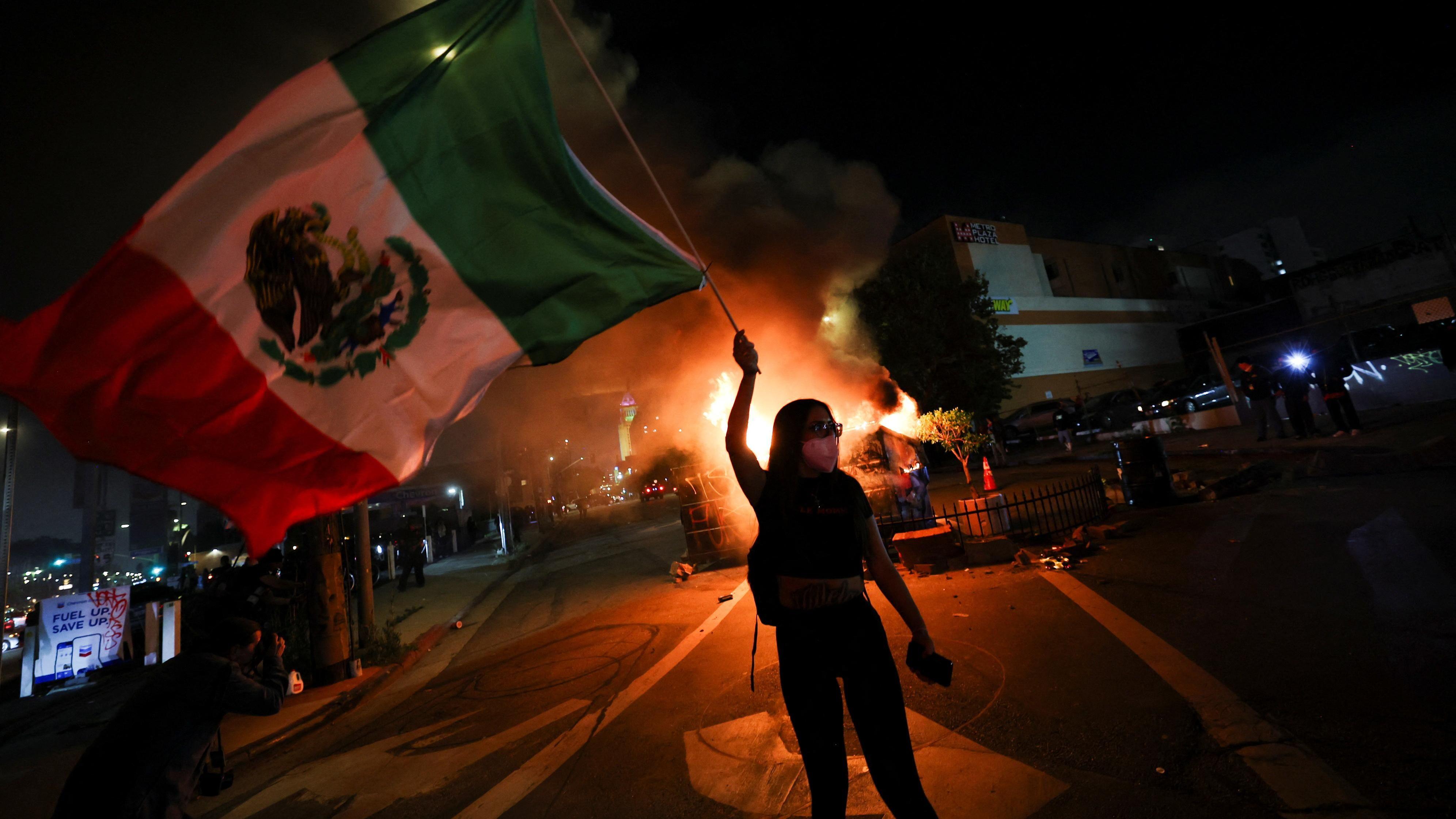 Police order protesters to leave downtown Los Angeles as Trump says 'bring in the troops'