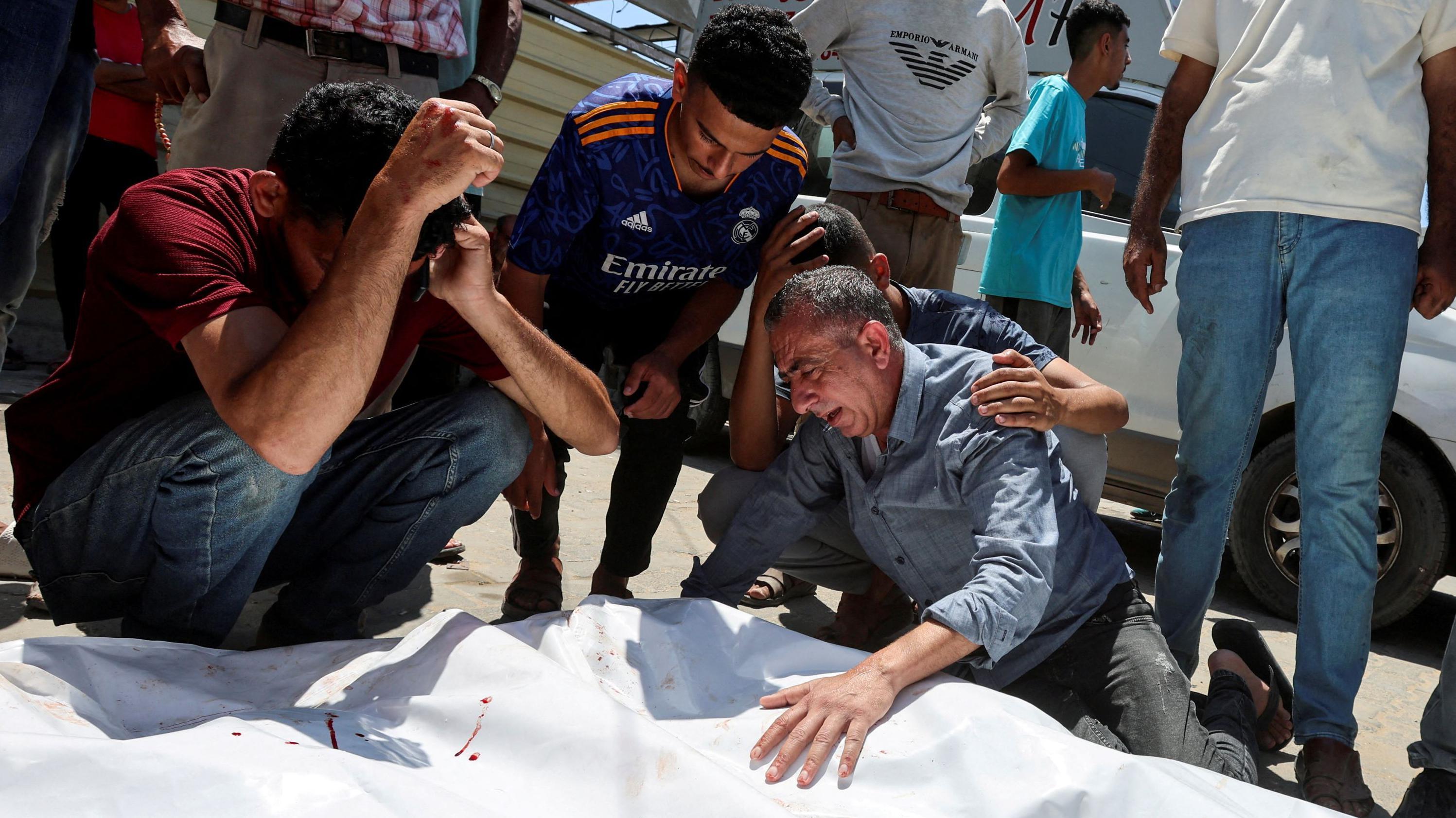 Israeli strike at Gaza market kills 18 Palestinians, doctor and witnesses say